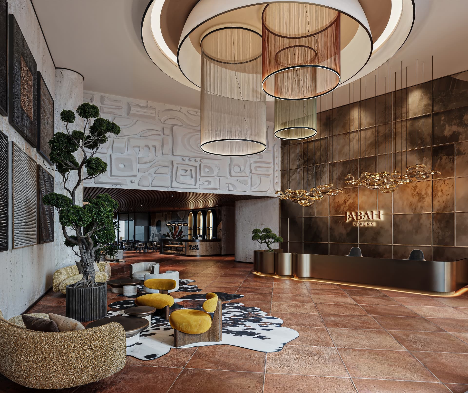 The double-height Jabali Towers residents' lobby, with sculpted ceiling lighting, bronze reception wall and lounge seating